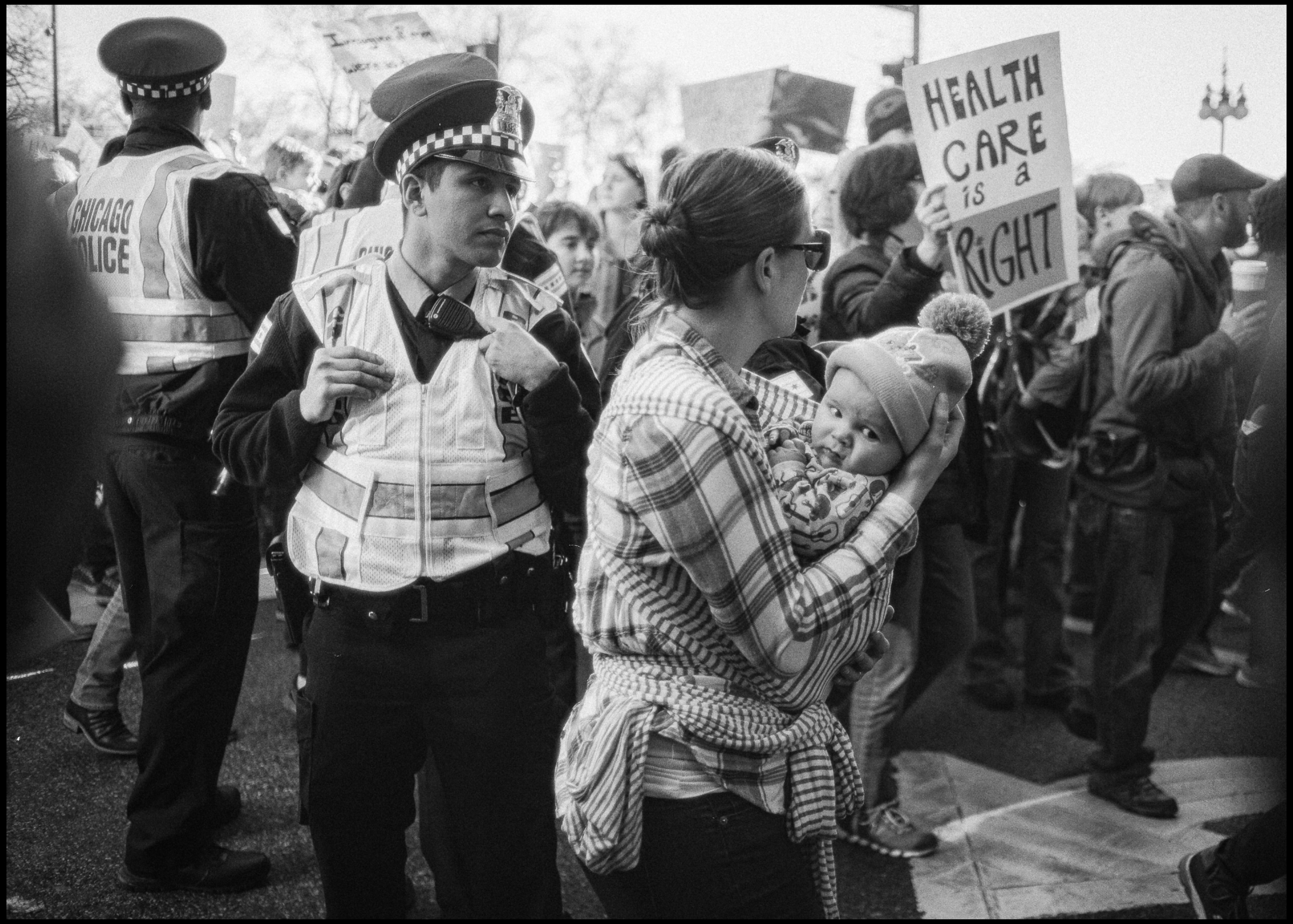 Baby in arms in the march crowd, Chicago 2017