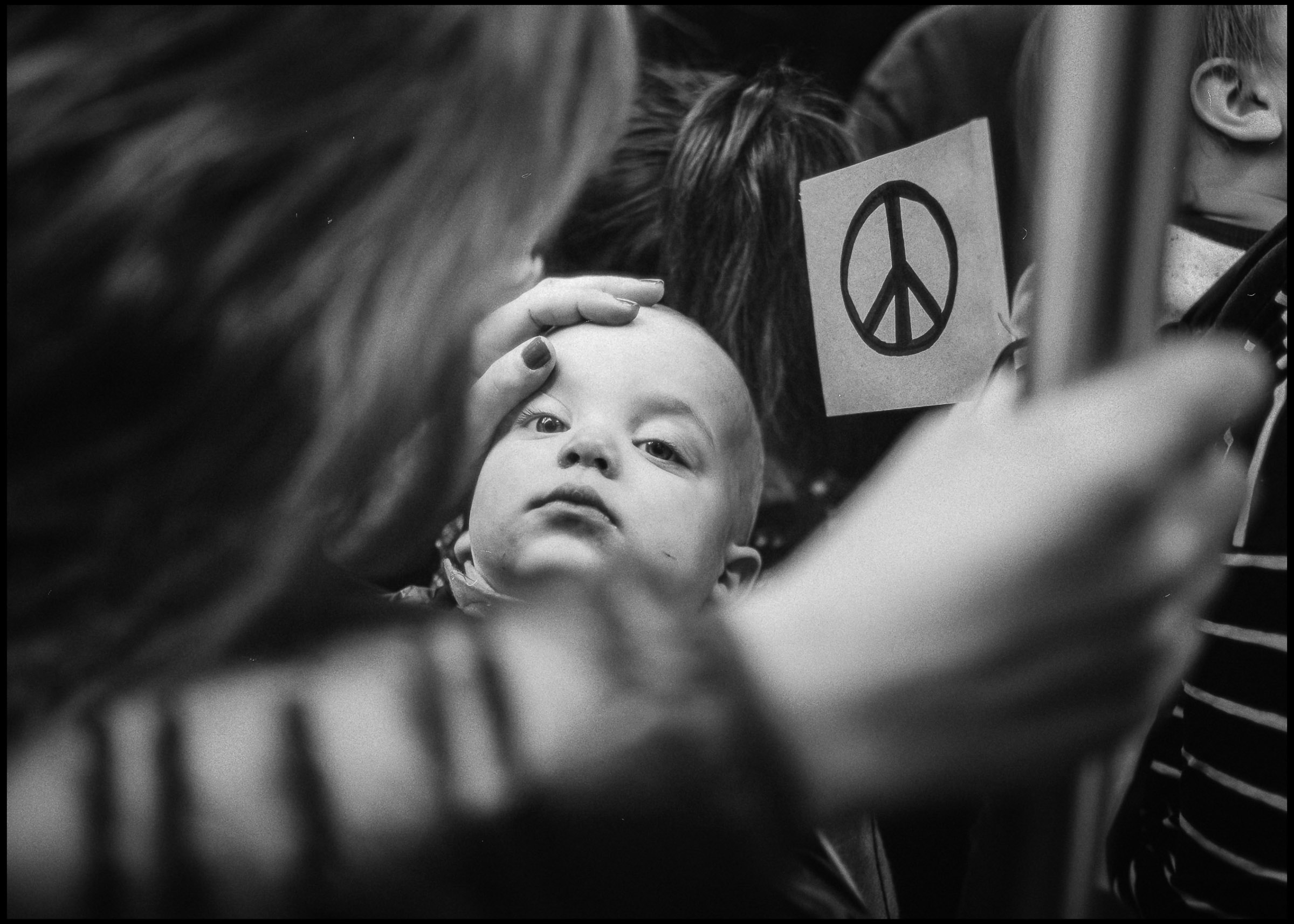Baby with peace sign imagery at the Women's March, Chicago 2017