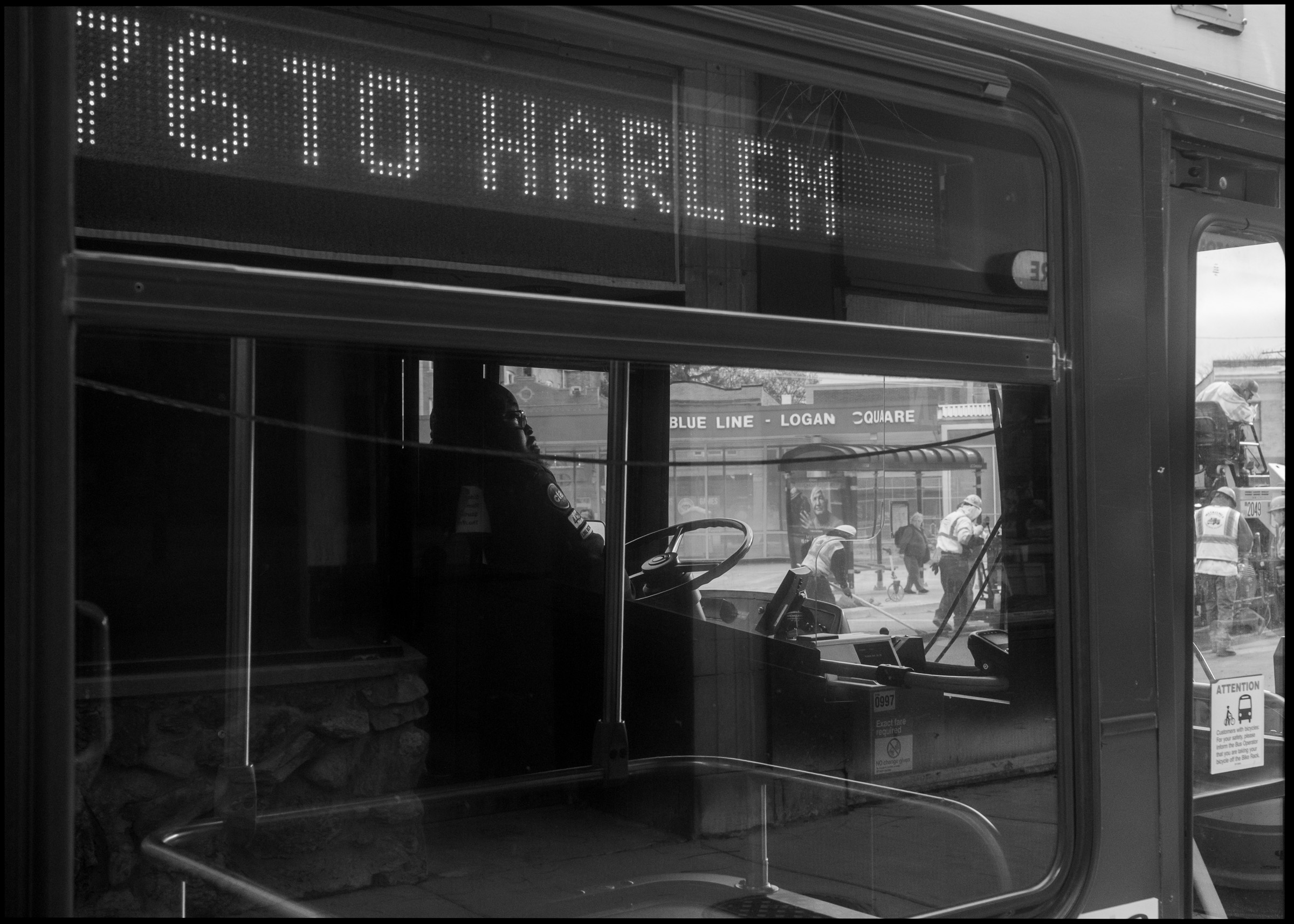 CTA bus interior reflection in Logan Square Chicago 2024
