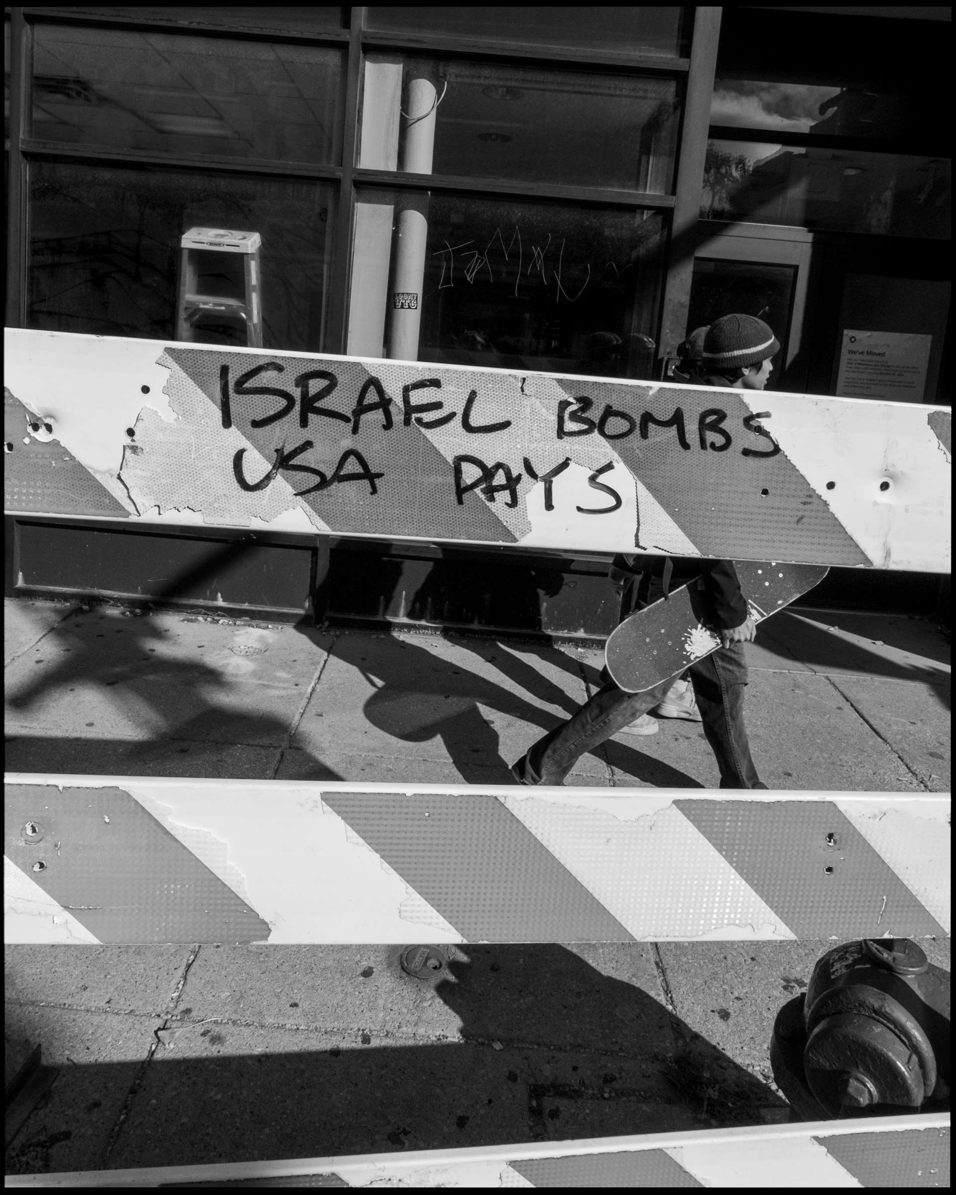 Israel Bombs USA Pays graffiti, Logan Square Chicago 2024